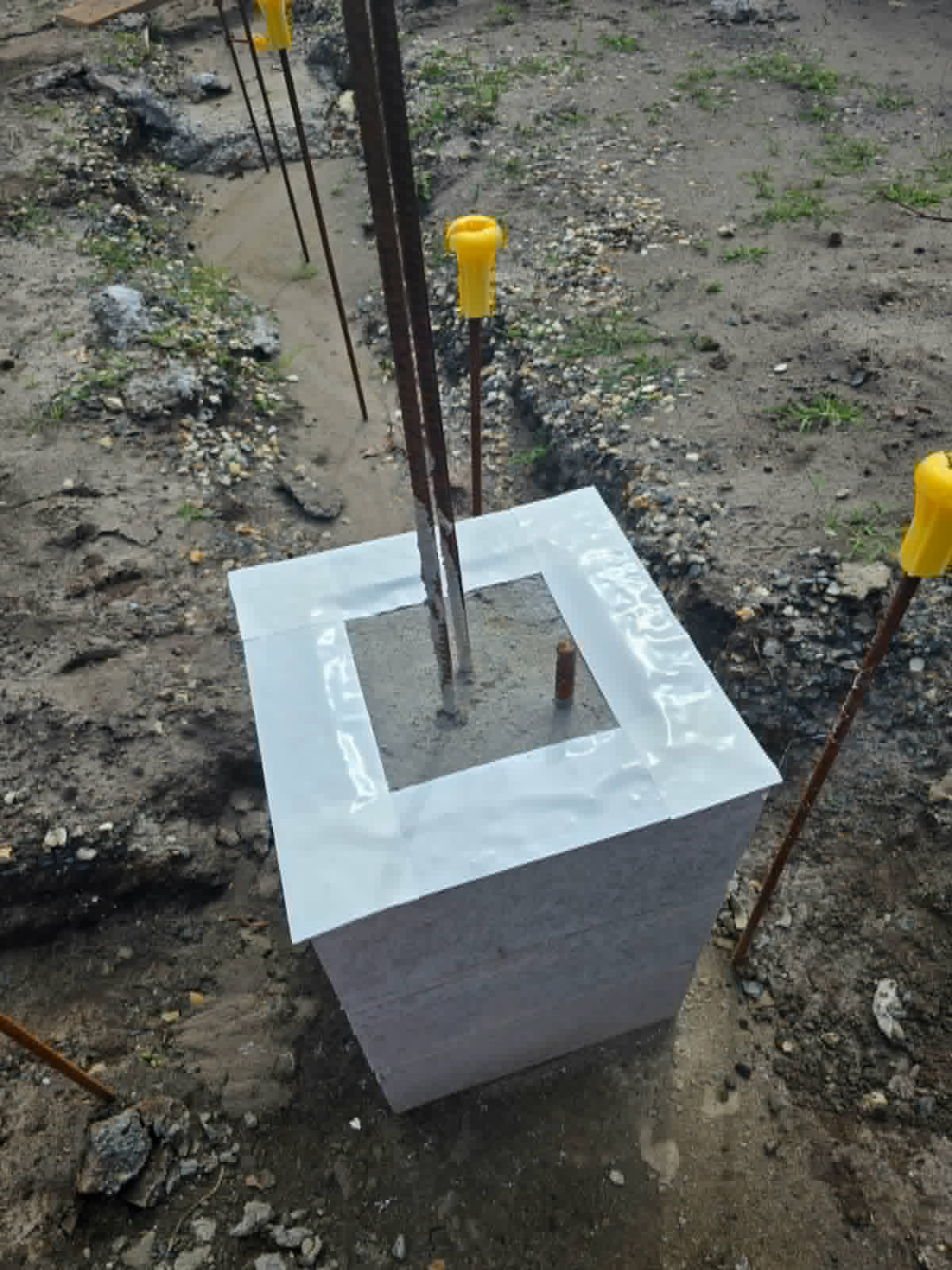 Physical termite barrier sheeting on a concrete foundation pillar