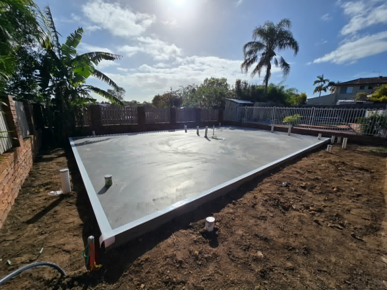 Termite barrier sheeting installed around a concrete slab perimeter